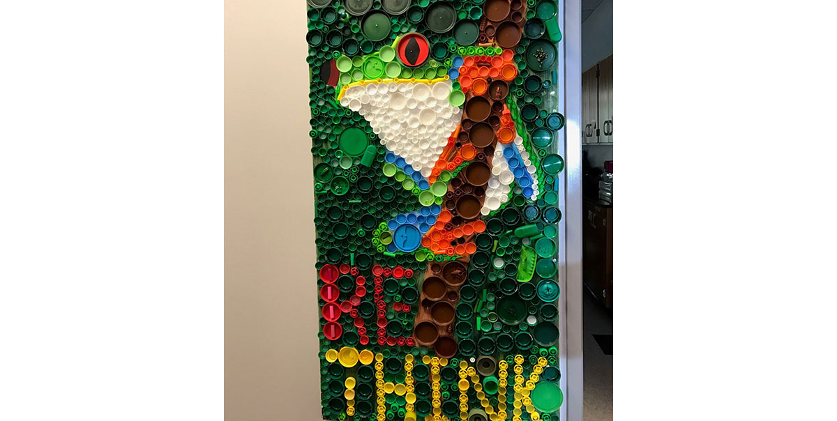 A Second Grade creation made from recycled caps.